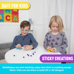KOMARC GAMES cubes next to a ruler showing 1 cm size for precise fine-motor work