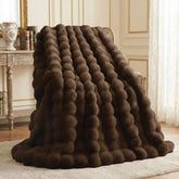 L'AGRATY front view cocoa brown throw showing plush appeal and elegant decor impact
