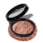 LAURA GELLER compact front view showing sleek packaging and bronzer benefit