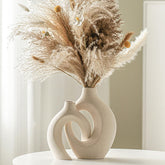 Lvases front view of the Snuggle set showing milky white matte finish and couple motif