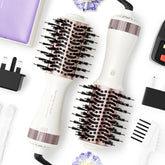 Madremía front view of travel dryer brush showing compact design and controls for easy packing