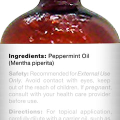 Majestic Pure dropper dispensing precise peppermint oil dose for controlled use