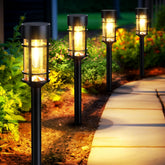 Mancra front view of 8-pack showing warm garden lighting benefit