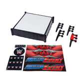 Mattel WWE ring front packaging showing Main Event and RAW labels and assembled ring for display
