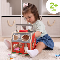 Melissa & Doug close-up of chunky wooden animal figure, highlights easy-grip design for toddlers