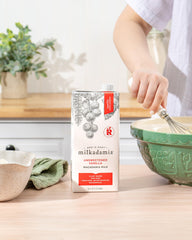 Milkadamia blended into a fruit smoothie bowl showing creamy body and low-calorie boost