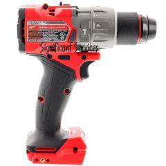 Milwaukee drill on belt clip beside tape measure showing compact scale and portability