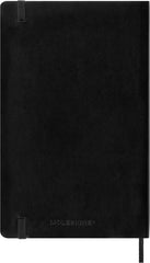 Moleskine ruled page close-up showing smooth ivory paper for neat handwriting