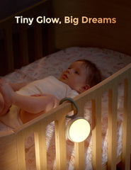 Momcozy amber nightlight glowing on crib providing soft illumination for feeds