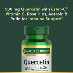 Nature's Bounty capsules beside quercetin-rich berries and onion