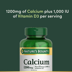 Nature's Bounty softgels in hand showing scale and portion for two-per-day use