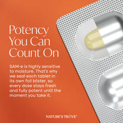 Nature's Trove caplet next to a coin showing size for easy dosing assessment