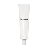 Nécessaire front packaging view showing minimalist tube and product benefits