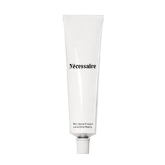 Nécessaire front packaging view showing minimalist tube and product benefits