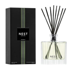 NEST New York front view of bamboo reed diffuser showing elegant glass vessel and reeds for long-lasting scent