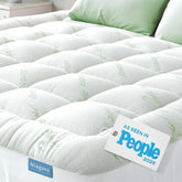 Niagara Sleep Solution front view showing full XL topper on bed and plush comfort