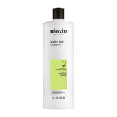 NIOXIN System 2 front bottle showing professional scalp cleanser benefit