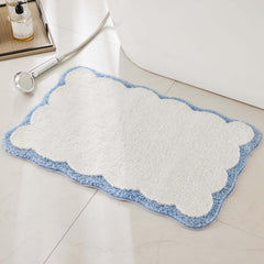 Ohocut front view white rug with blue scalloped piping shows clean aesthetic and softness