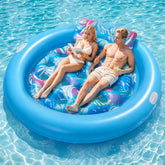 OKSUWATER front view of full 75x75 blue float showing roomy platform and shape