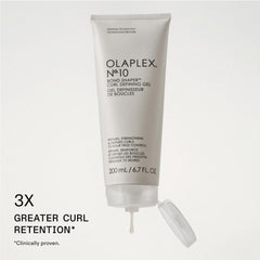Olaplex N°.10 dispensing gel from cap showing easy application benefit
