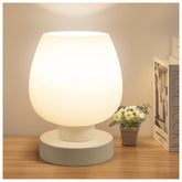 ONEWISH front view of compact bedside lamp showing modern profile and soft light