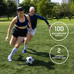 Hand holding Optimum Nutrition capsule to demonstrate serving scale and portability
