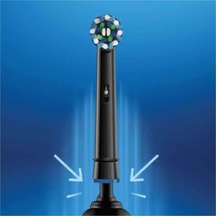 Oral-B brush head attached to handle demonstrating easy snap-on replacement