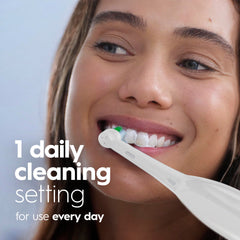 Person using Oral-B Pro 100 in bathroom delivering consistent cleaning action