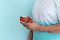 Oregon Chai pouring concentrate into a pitcher for fast batch prep