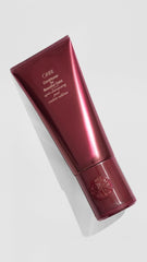 Oribe conditioner cream texture close-up highlighting rich moisturizing benefit