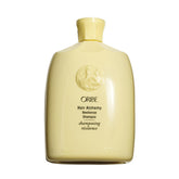 Oribe front packaging showing Hair Alchemy strengthening shampoo benefits