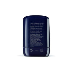 Oribe wax stick with cap off and twist-up showing easy application benefit