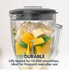 Oster 3-cup food chopper with S-blade showing fast prep of herbs and nuts