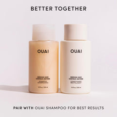 Applying OUAI conditioner in hand demonstrating easy distribution and slip