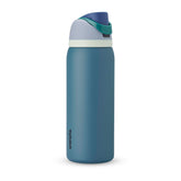 Owala FreeSip front view shows denim bottle and ergonomic carry loop for easy transport