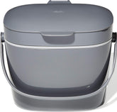 OXO Good Grips front view showing compact charcoal bin and tidy countertop benefit