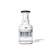 OXO chopper front view showing compact design and clear catcher cup benefit
