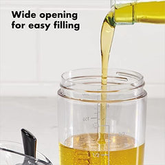 OXO shaker closeup of flip lever pour mechanism for one-handed controlled serving