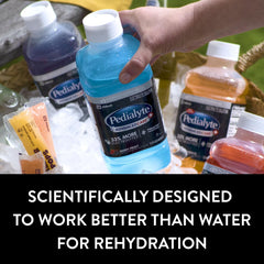 Pedialyte bottle on sports field illustrating on-the-go rehydration for athletes and active adults