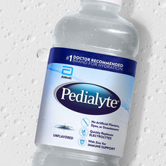 Pedialyte pouring into a glass to show ease of serving and quick hydration option