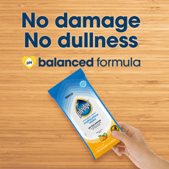 Pledge cleaning kitchen counter showing streak-free surface benefit