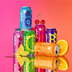 All Poppi flavors from the pack arranged to show Lemon Lime, Grape, Orange Cream, Cherry Cola, Wild Berry, Doc Pop