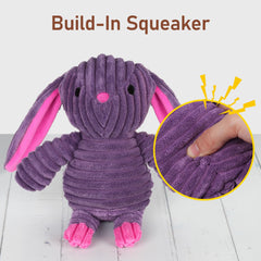 PrimePets purple rabbit toy held by a dog illustrating engaging squeak play