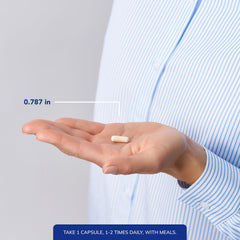 Pure Encapsulations capsule next to a coin for scale indicating compact size