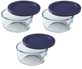 Pyrex 7200 front view showing three glass bowls with dark blue lids, durable storage