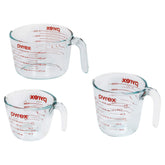 Pyrex front view of three measuring cups showing sizes and benefit of clear volume visibility