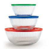 Pyrex sculpted front view showing three glass bowls and lids, clear and durable benefit