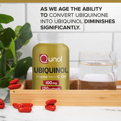 hand holding one Qunol softgel to show serving size and ease