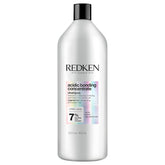 redken bottle front view showing product and brand benefits
