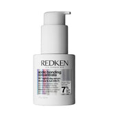 Redken mini front packaging showing compact repair serum — convenient travel size
